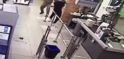 Agressive guy gets taken out by security guard.