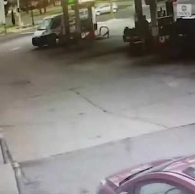 Fire truck crashes into pole at gas station.