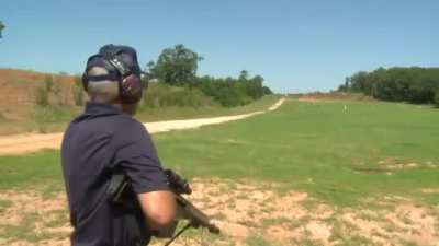 Jerry Miculek shooting the target 1000 yards away in under 3 secs.