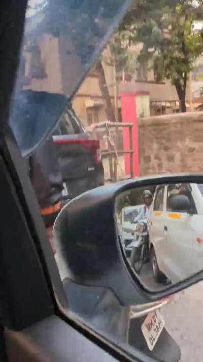Why is mumbai bikers bcome such gundas?? He tried to bang my glass door and abused me even when there was no space for anyone to move
