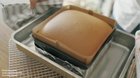 Cutting fresh Castella cake