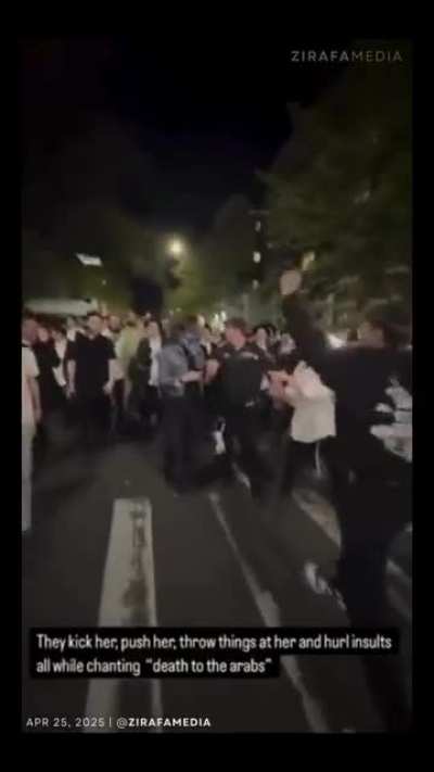 Zionist gang attacking a women in NYC. Lone NYPD officer offers little help