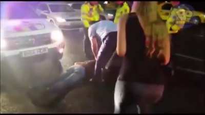 Arrested man decides a kick to the police officer's genitals might deescalate the situation.... He chose poorly