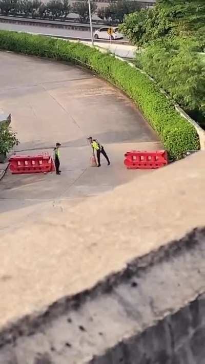 Traffic cone flip challenge with homies on the job