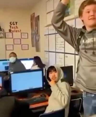 Students in Arizona hitting another student with a chair and thinks it's funny.