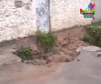 WCGW Riding a bicycle too close to a sinkhole.