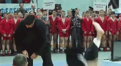 Glorious martial arts instructor Steven Seagal demonstrates how to take an opponent down