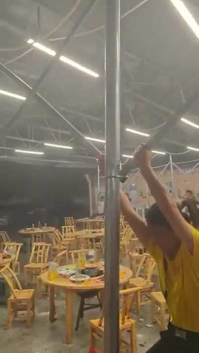 Holding onto a tent during a storm