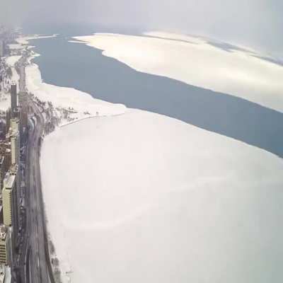 Time-lapse of a giant ice sheet in Lake Michigan breaking off and floating away from February.