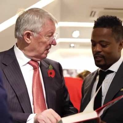 Patrice Evra signing a copy of his autobiography for Sir Alex (from Evra's Instagram)