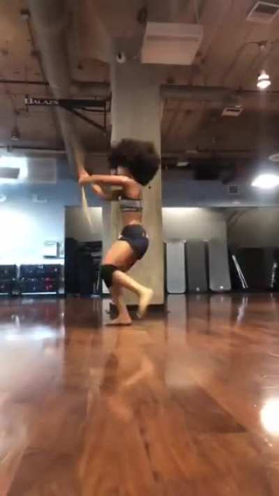 A woman demonstrates her staff bonking abilities