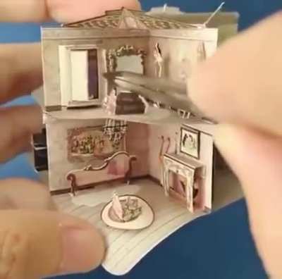 A miniature dollhouse in a book