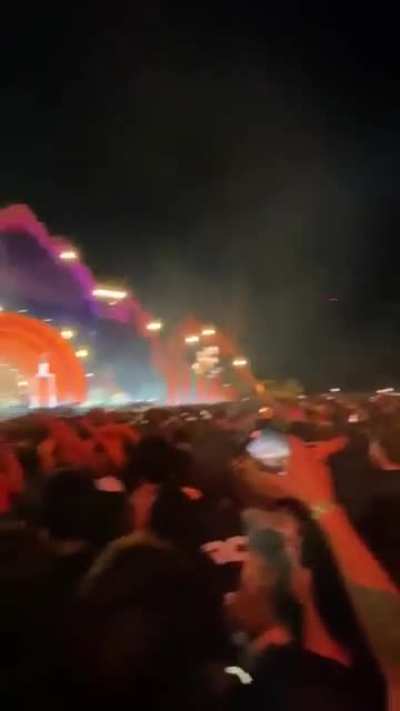 Fans in the back chant 