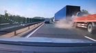 Car is smashed between two trucks