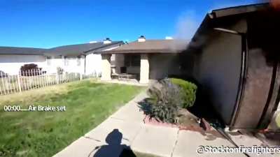 This firefighter kicking down doors like it's the movies