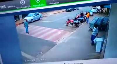 Security camera catches footage of pedestrian being ran over on crosswalk by street racers.