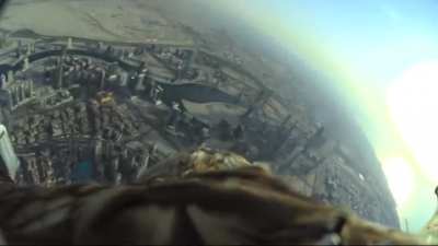 This eagle was released from the top of Dubai's Burj Khalifapp with a camera installed on its back in order to search for its trainer who was exactly 10 blocks away. The spotted his coach, who was in a small Campo, it folded its wings and plunged into fre