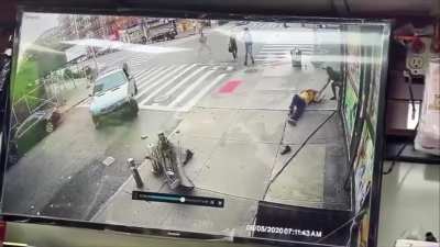 Manhattan shop owner saves man who was struck by a car. Driver later escaped on foot but was arrested. Victim is recovering in Harlem hospital.