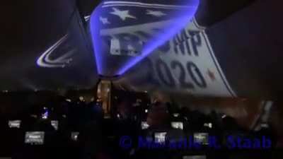 On a plane from TX DC flight attendants are struggling to control a plane full of Trump supporters as they display a pro-Trump projection and harass others passengers bound for DC.