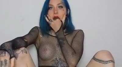 Blue Hair Light Blue Eyes Many Tatoos And A Puking Smile