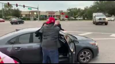 Man confronts and sucker punches Trump supporter at roadside rally .. doesn't go as planned