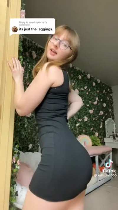 Showing off her ass in a dress