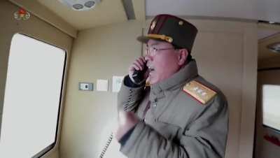 North Korea's state-run television shows the moment the country's military officials count down from 10 before they push what appears to be the launch button for Thursday's ICBM.