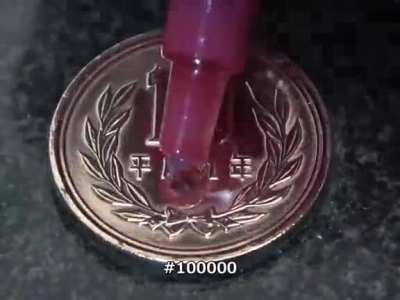 Polishing a coin.