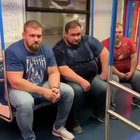 3 dudes getting off the subway.