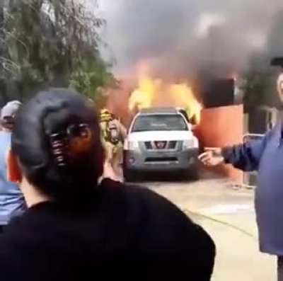 Dad runs into a burning building to save the family dog