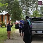 Principal of a high school, along with staff, deliver personalized yard signs to 2020 seniors as a way of congratulating them