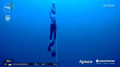 Nataliia Zharkova free diving past all the levels to set a world record of 93 meters (305 feet) deep