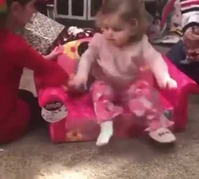 This little girl is so excited about her Minnie chair
