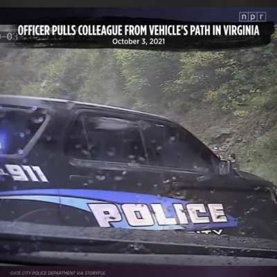 Hydroplaning car almost hulk smashes officers and pedestrians.