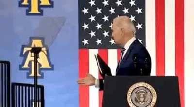 Joe Biden try to shake John cena hand