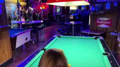 Naughty girl on her way to play pool