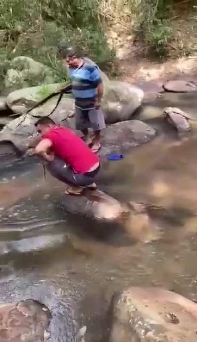 Shooting a gun in a river