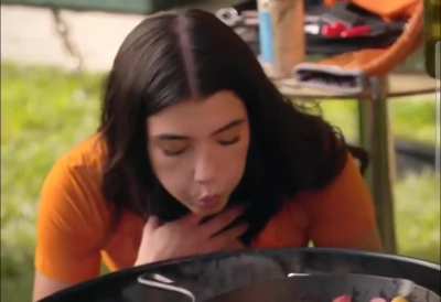 Charli blowing 