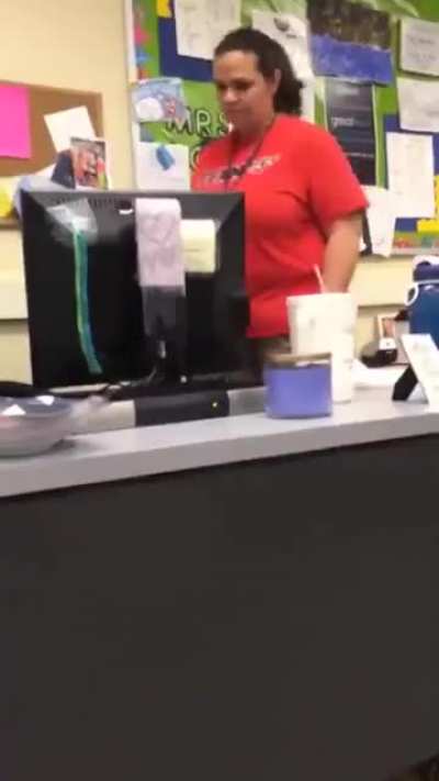 Student hides under desk and grabs teacher's ankle
