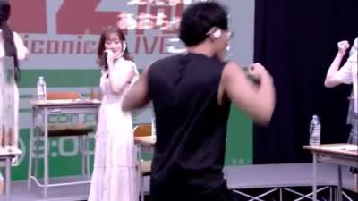 Super fitness trainer Ryota Suzuki demonstrates how to flex muscles (while Aoi Koga loses her shit and mess around in the background)