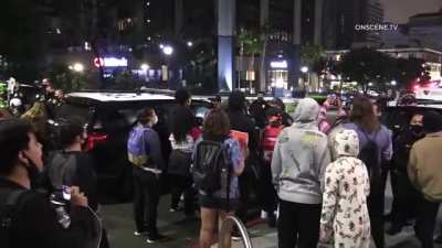 Protesters protesting the death of an armed robber in San Diego, CA attack a man holding a puppy for disagreeing with their protest. The protester 