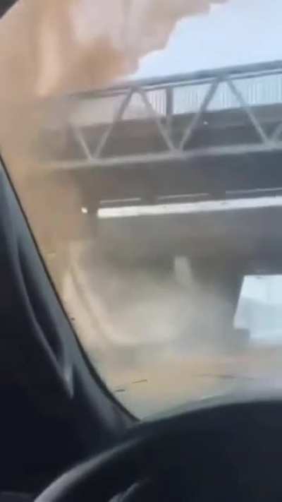 Truck charging ahead for the bridge