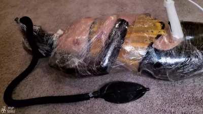 Rubberdoll mummified in tight plastic is forced to cum multiple times on a magic wand