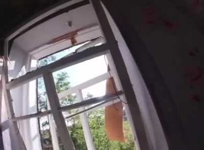 Ukrainian soldier shooting at two Russian soldiers from a window (Summer 2022)