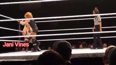 Becky stomps on Alexa’s belly and chokes her with her boot at the WWE’s live show at Fort Wayne.