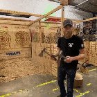 Guy is incredibly nonchalant and accurate with axe throwing