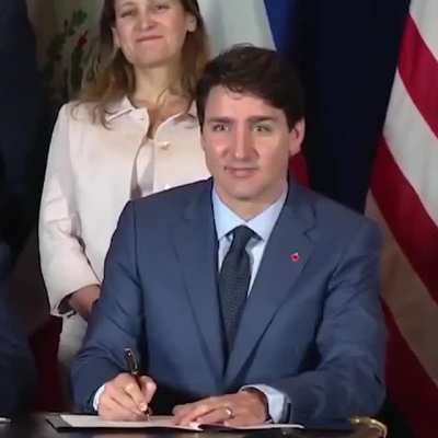 The look on their faces as Trump signs the NAFTA agreements wrong