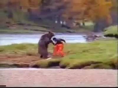 MAN TRIES TO FIGHT BEAR