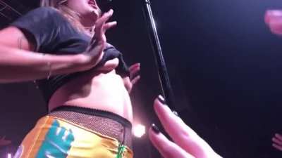 Tove Lo flashing during a concert