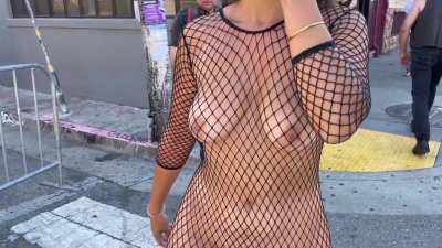 Wearing only a fishnet dress in public
